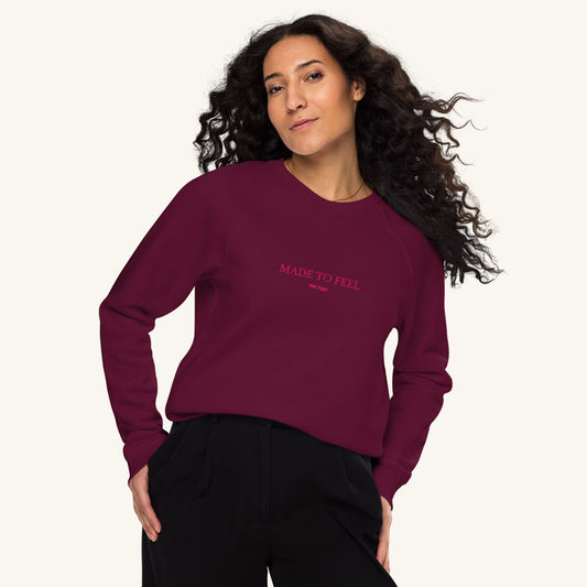 Unisex FEEL Blend Sweater in burgundy with lipstick pink embroidery, minimalist sustainable design by Miss Piggy.