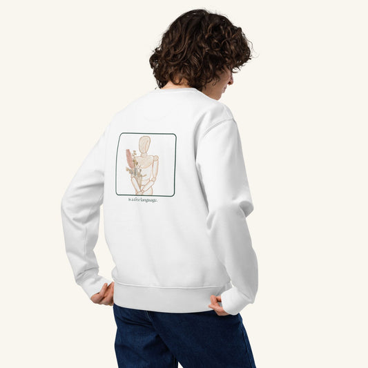 Unisex CONSISTENCY Organic Sweater in white with green print, minimalist sustainable design by Miss Piggy.