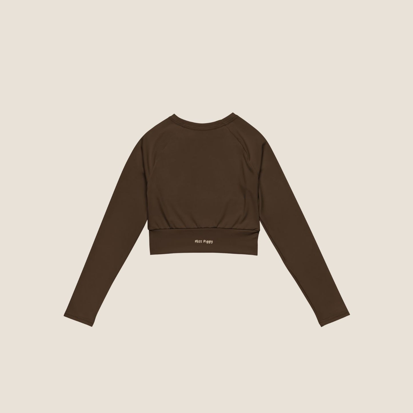Long sleeve UNSEEN MOVE Layer in espresso brown with sand print, sustainable activewear by Miss Piggy.