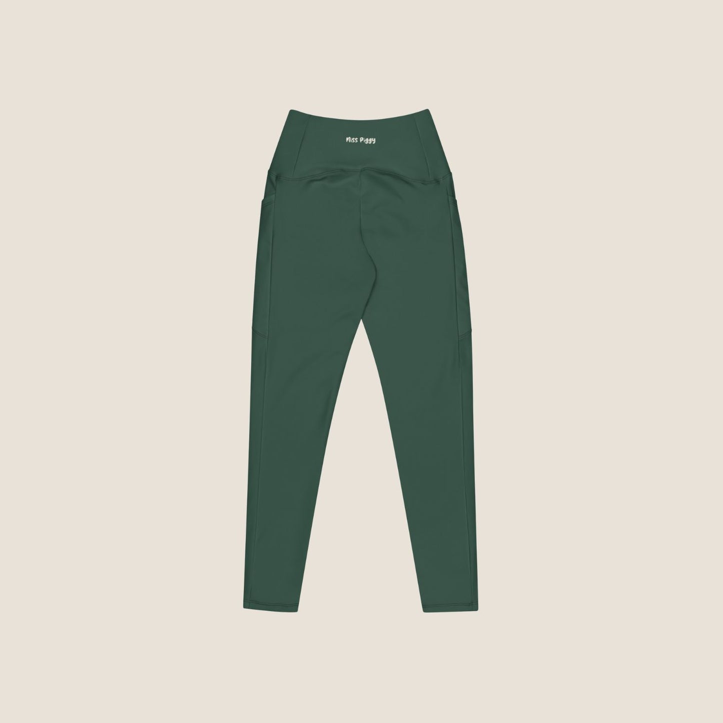 DEEP MOVE Leggings in forest green with off-white print, made from recycled materials.