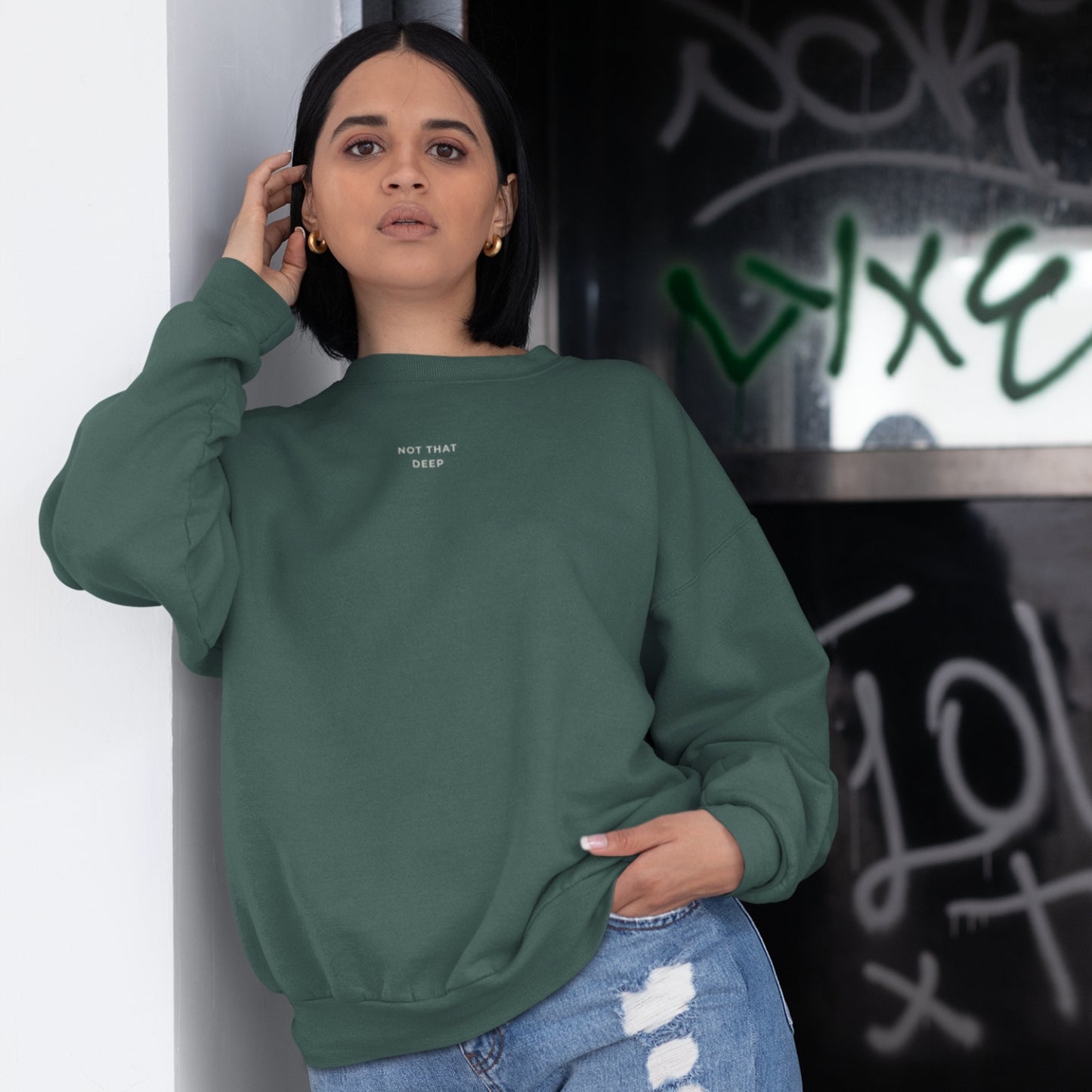 Unisex DEEP Recycled Sweater in forest green with off-white print, sustainable comfort by Miss Piggy – Soulwear.