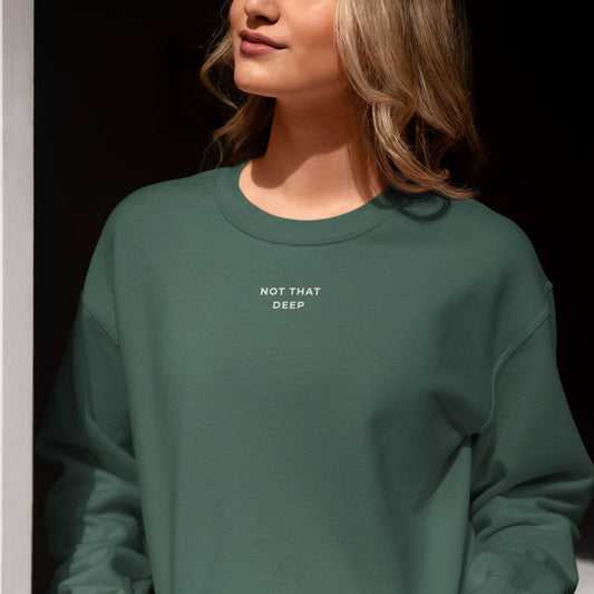 Unisex DEEP Recycled Sweater in forest green with off-white print, sustainable comfort by Miss Piggy – Soulwear.