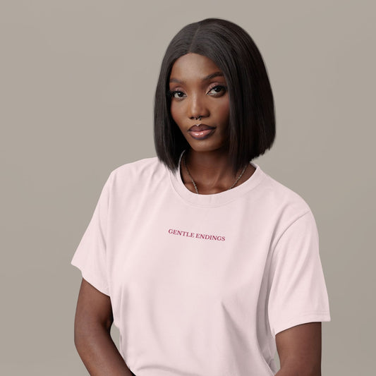 Gentle Endings Organic T-Shirt in cotton pink with small lipstick pink print in front and featuring in back a star illustration and message.