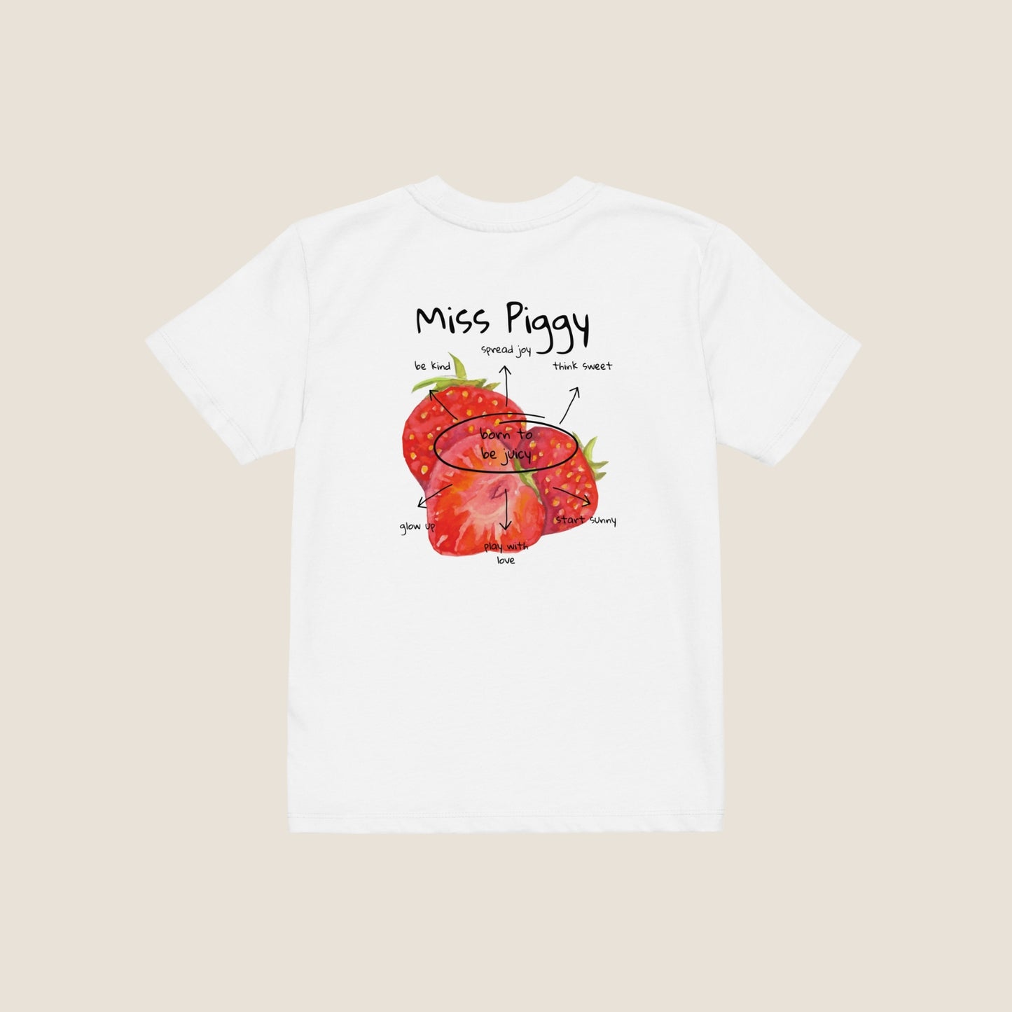 Two kids wearing the JUICY t-shirt in white. Unisex organic cotton design with soft texture and playful energy, shown in a light and joyful setting.