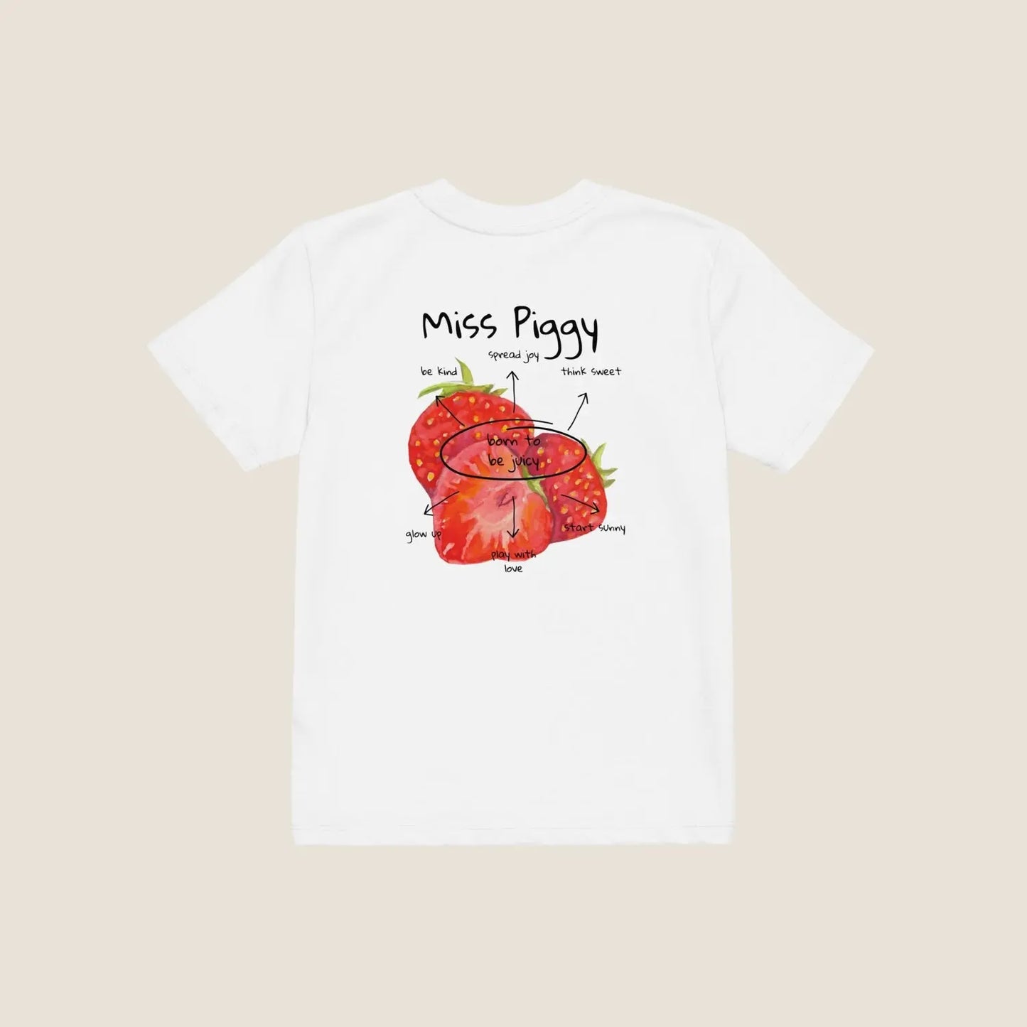 Two kids wearing the JUICY t-shirt in white. Unisex organic cotton design with soft texture and playful energy, shown in a light and joyful setting.