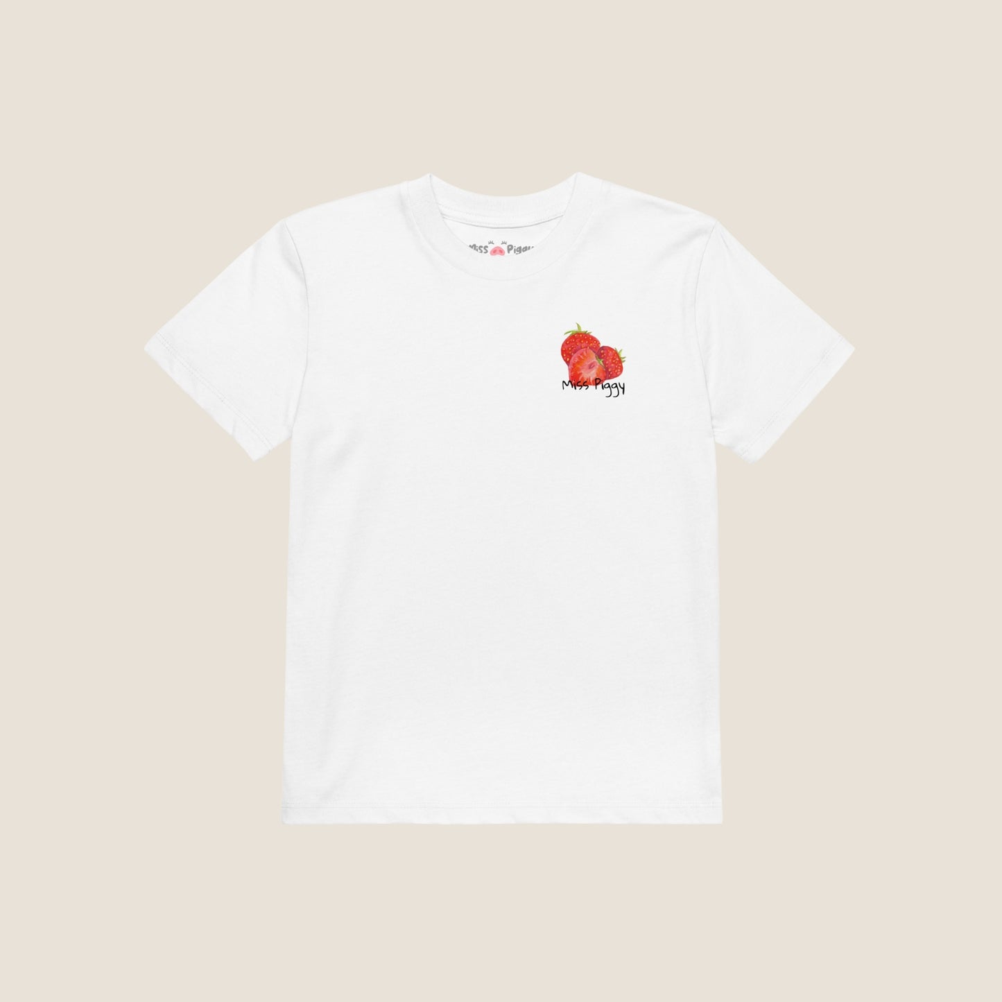 Two kids wearing the JUICY t-shirt in white. Unisex organic cotton design with soft texture and playful energy, shown in a light and joyful setting.