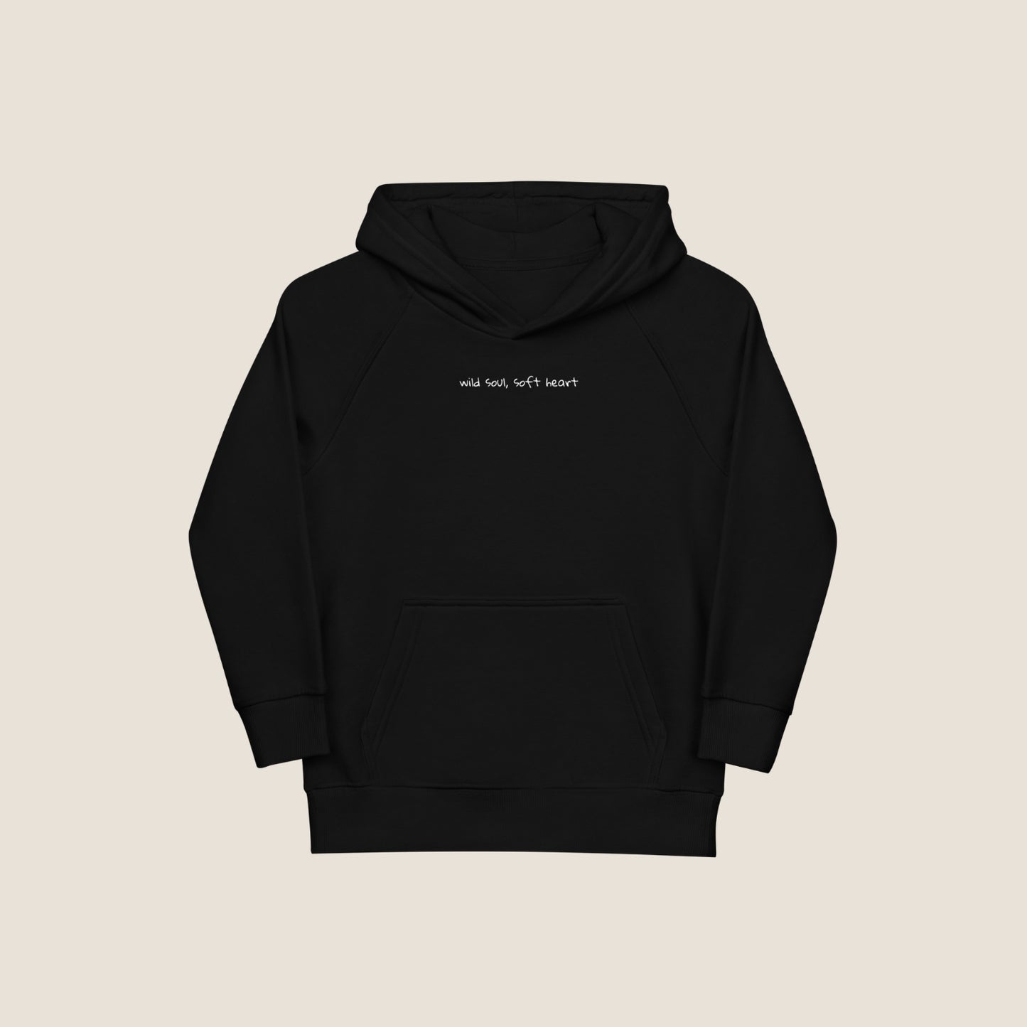 Child wearing the SOUL SNUG hoodie in a relaxed fit, made from organic cotton and recycled polyester. Unisex design with soft texture and natural tone, photographed against a light, playful background