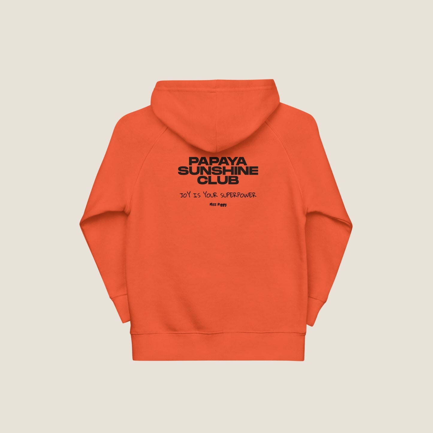Child wearing the SUN CLUB hoodie in a relaxed fit, made from organic cotton and recycled polyester. Unisex design with soft texture and natural tone, photographed against a light, playful background.