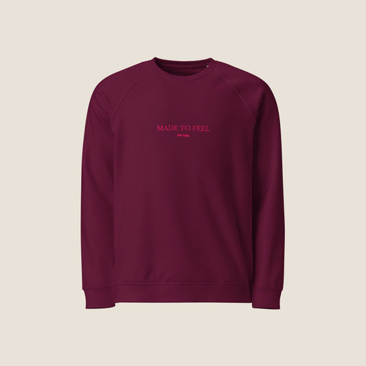 Unisex FEEL Blend Sweater in burgundy with lipstick pink embroidery, minimalist sustainable design by Miss Piggy.