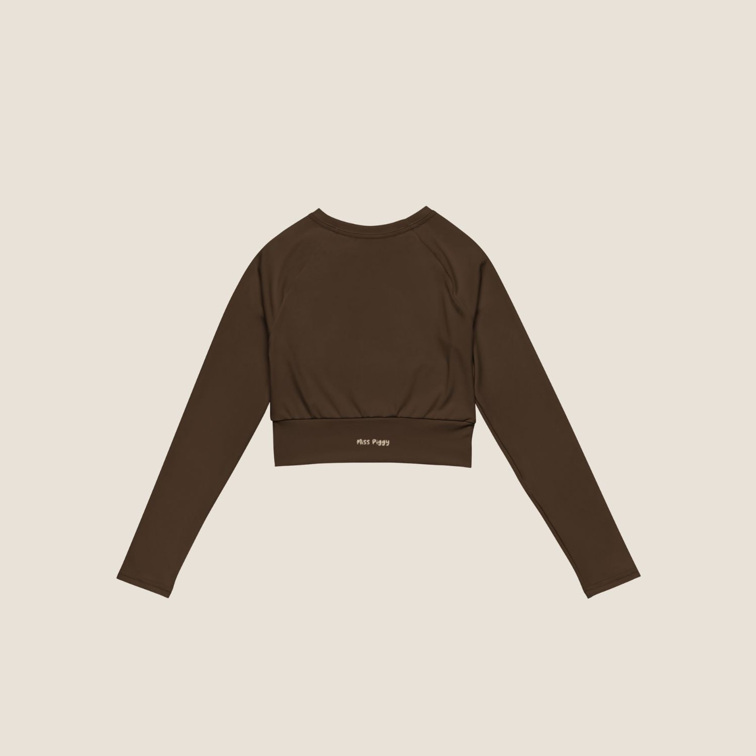 Long sleeve UNSEEN MOVE Layer in espresso brown with sand print, sustainable activewear by Miss Piggy.
