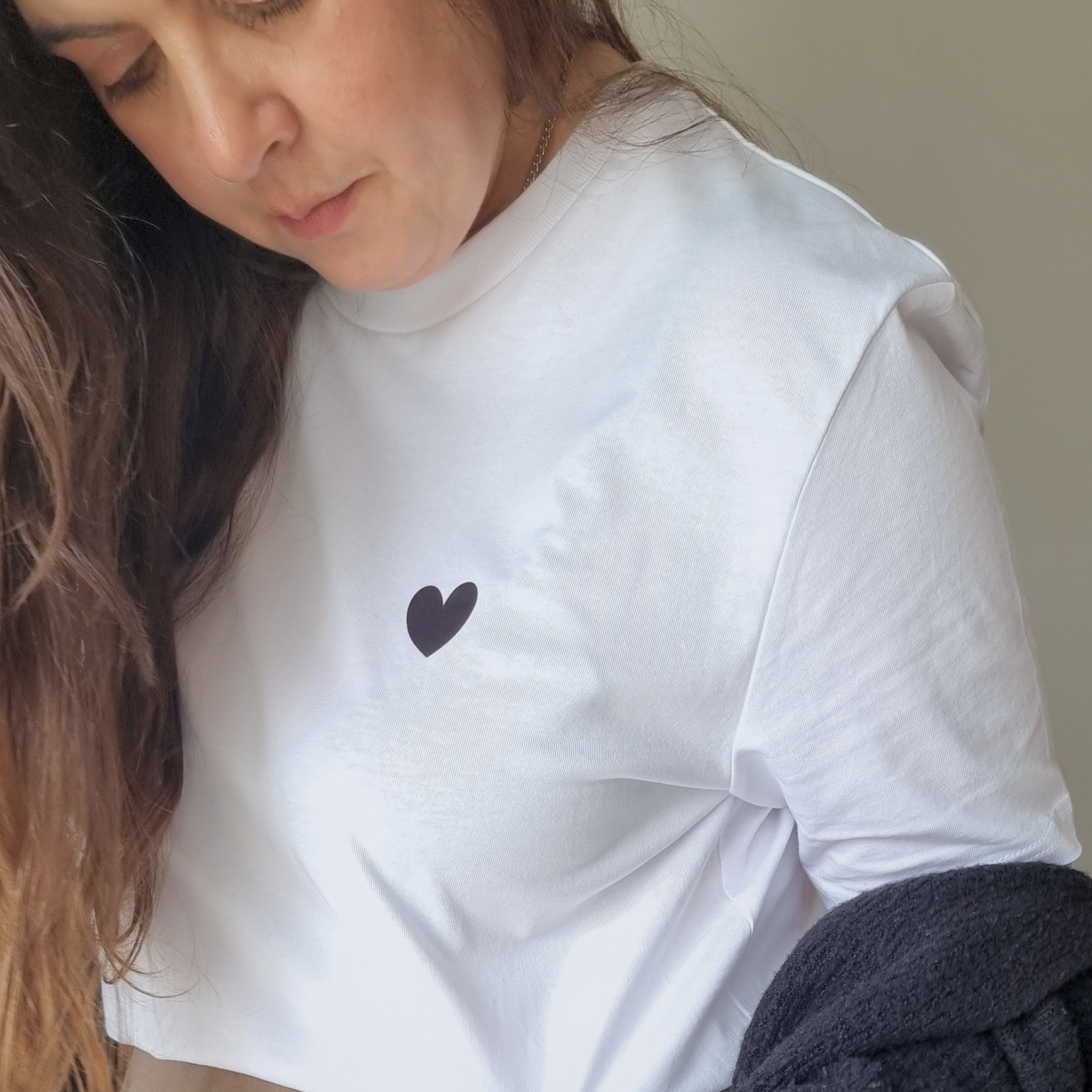 Founder wearing HEART t-shirt with a black heart design.
