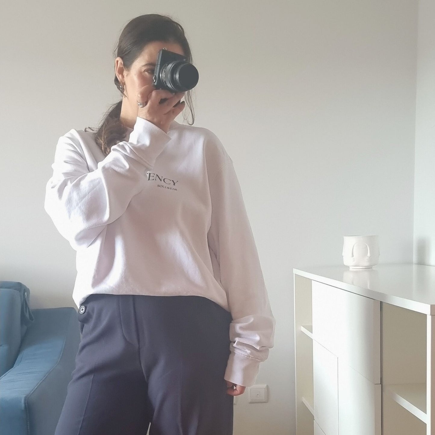 Unisex CONSISTENCY Organic Sweater in white with green print, minimalist sustainable design by Miss Piggy.