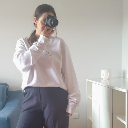 Unisex CONSISTENCY Organic Sweater in white with green print, minimalist sustainable design by Miss Piggy.