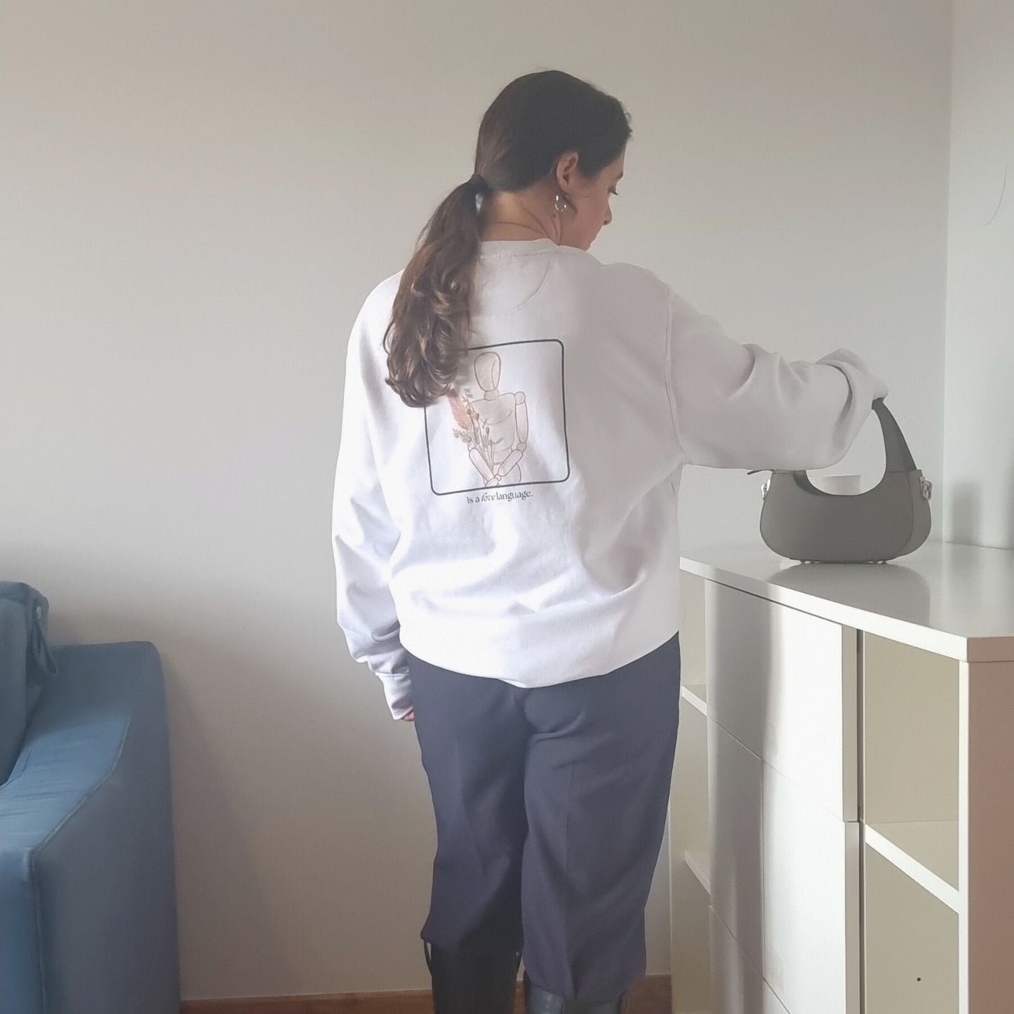 Unisex CONSISTENCY Organic Sweater in white with green print, minimalist sustainable design by Miss Piggy.