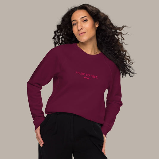 Unisex FEEL Blend Sweater in burgundy with lipstick pink embroidery, minimalist sustainable design by Miss Piggy.
