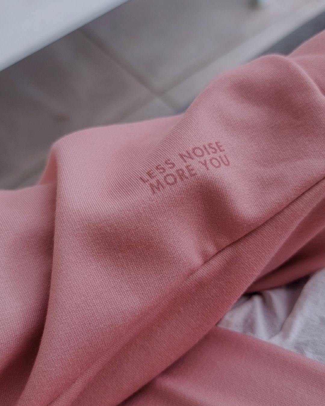 MISS PIGGY BASICS Recycled Hoodie in clay pink with mauve print, sustainable comfort made from recycled polyester.