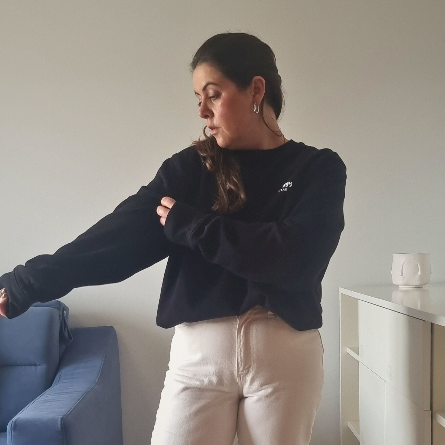 Unisex PROTOCOL Organic Sweater in black with white print, minimalist sustainable design by Miss Piggy.