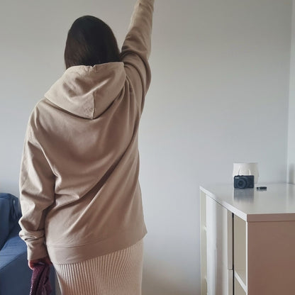 CALM Organic Hoodie in desert beige with camel print, sustainable comfort made from organic cotton.