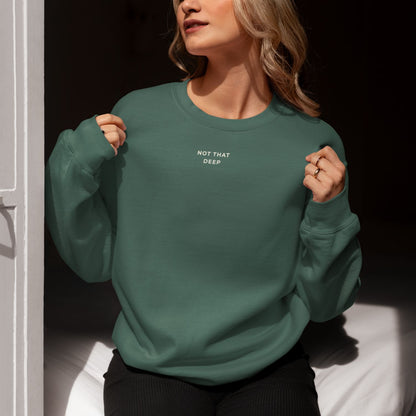 Unisex DEEP Recycled Sweater in forest green with off-white print, sustainable comfort by Miss Piggy – Soulwear.