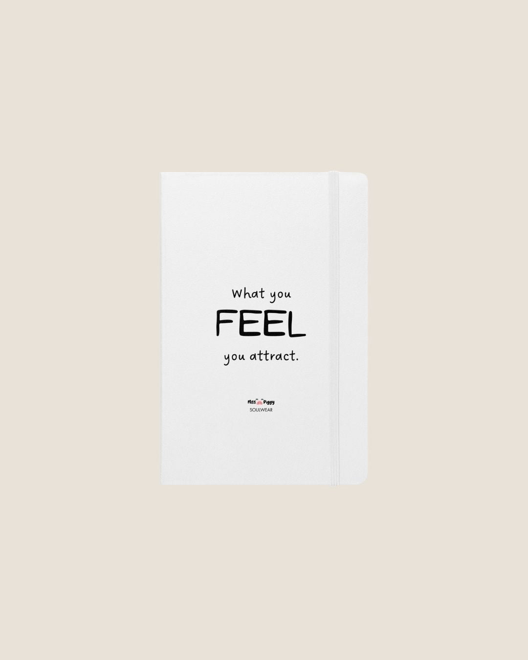 A durable Notebook UltraHyde hardcover, 80 lined cream pages, a matching elastic closure, and a ribbon bookmark with motivational quote.