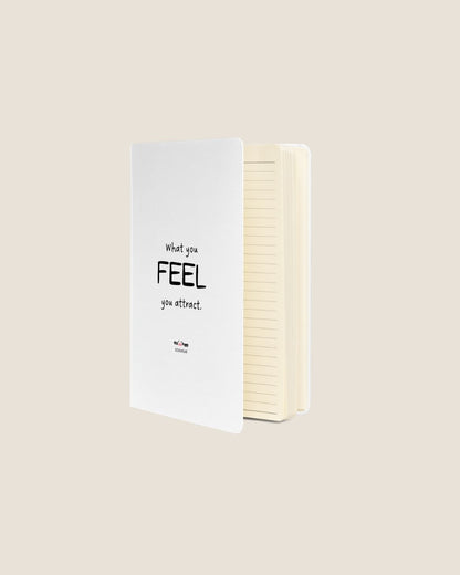 A durable Notebook UltraHyde hardcover, 80 lined cream pages, a matching elastic closure, and a ribbon bookmark with motivational quote.