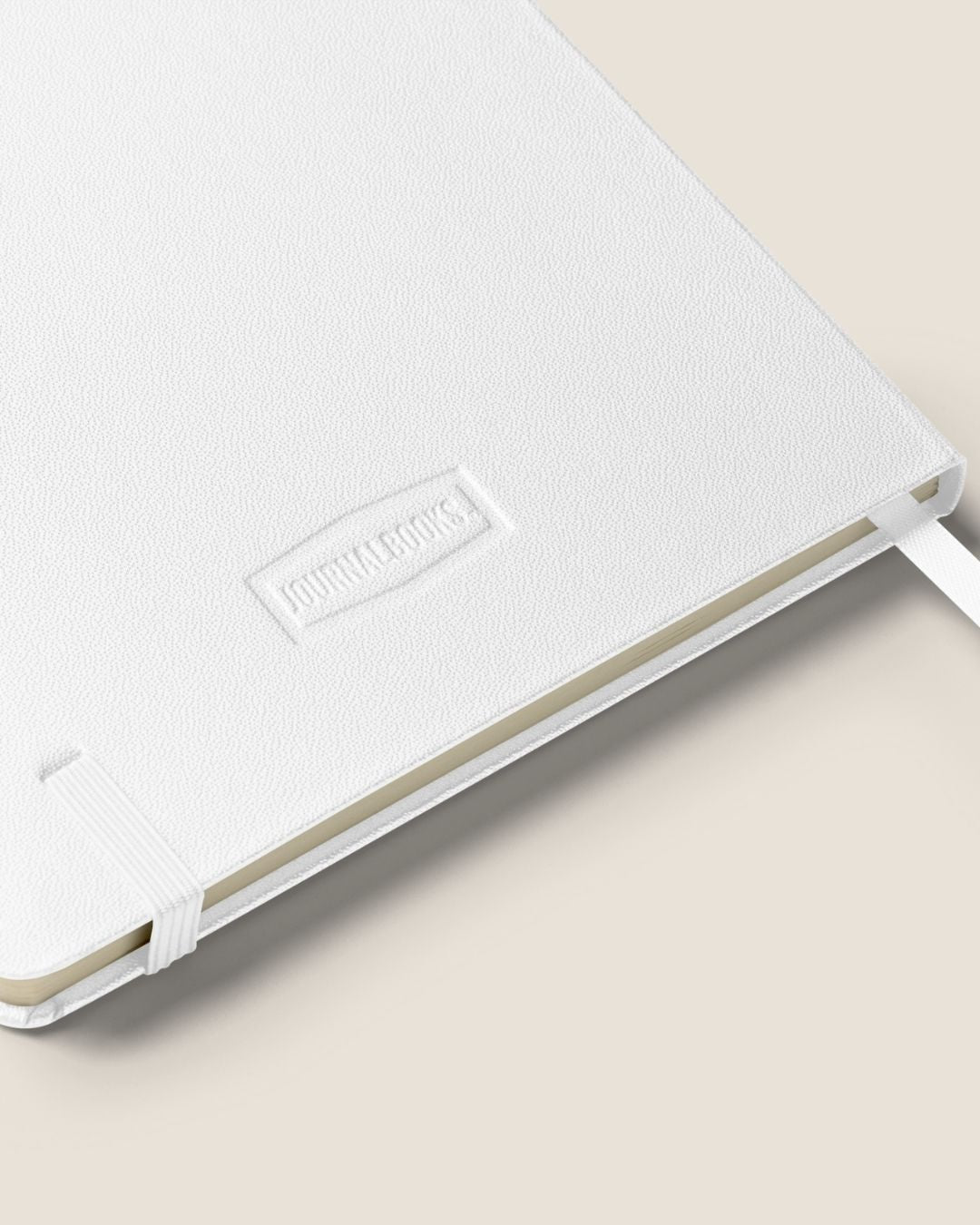 A durable Notebook UltraHyde hardcover, 80 lined cream pages, a matching elastic closure, and a ribbon bookmark with motivational quote.