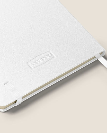 A durable Notebook UltraHyde hardcover, 80 lined cream pages, a matching elastic closure, and a ribbon bookmark with motivational quote.