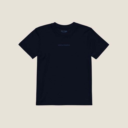 Organic kids t-shirt in navy with Gentle Endings front print and back featuring star illustration and Gentle Endings message.