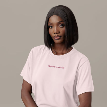 Gentle Endings Organic T-Shirt in cotton pink with small lipstick pink print in front  and featuring in back a star illustration and message.