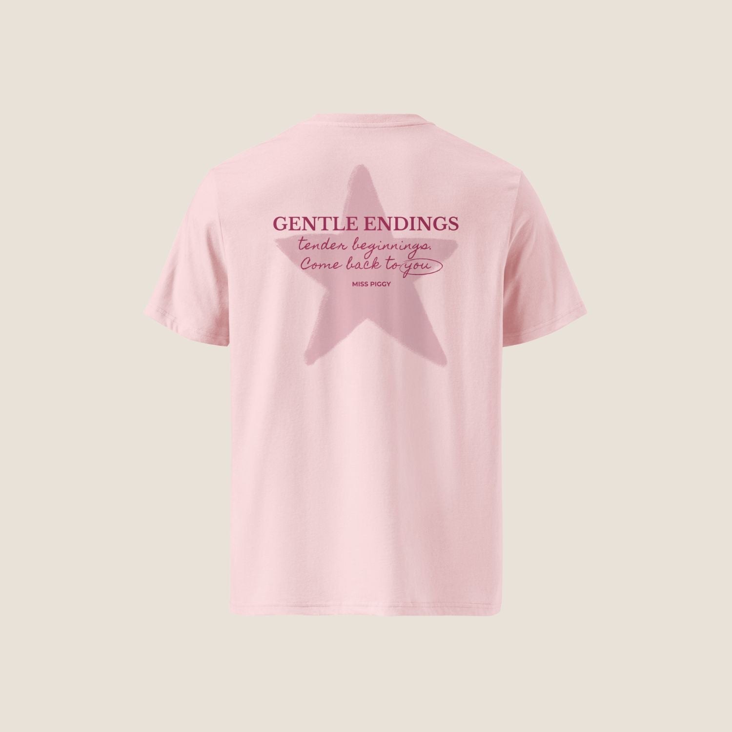 Gentle Endings Organic T-Shirt in cotton pink with small lipstick pink print in front  and featuring in back a star illustration and message.
