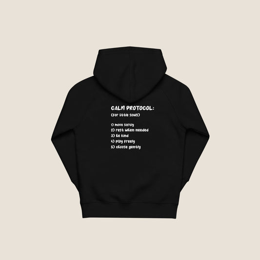 Protocol Organic Kids Hoodie in black with minimal Miss Piggy print in front and back with protocol-style list design.